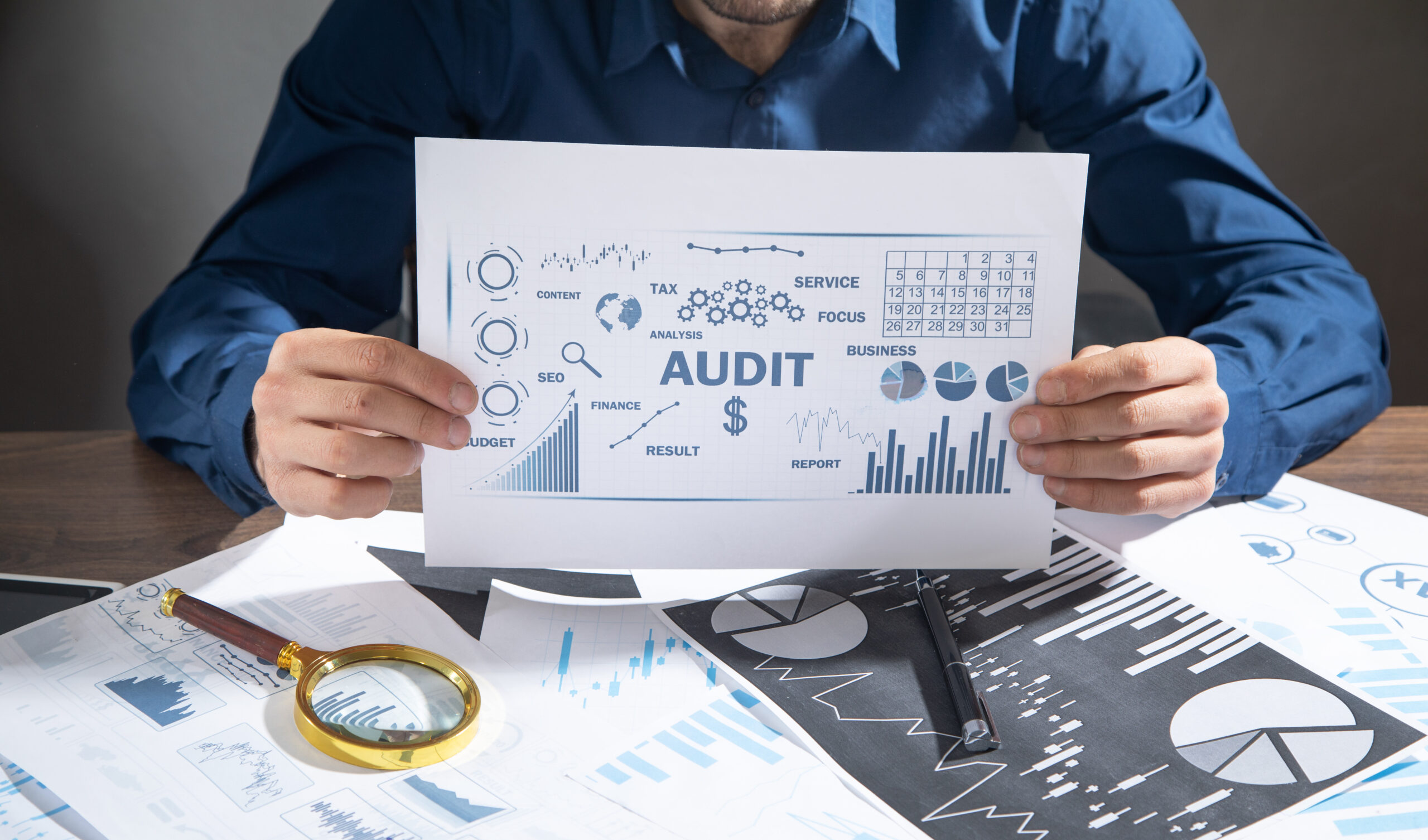Man showing Audit. Business charts with words